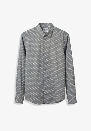 Chemise grise à manches longues avec boutons, motif à traits blancs, col pointu et poignets boutonnés, présentée à plat sur un fond blanc.