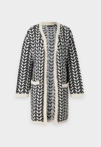 Cardigan in bianco e nero con motivo a zigzag, apertura frontale, maniche lunghe e due tasche frontali. Rifiniture a coste di colore crema.