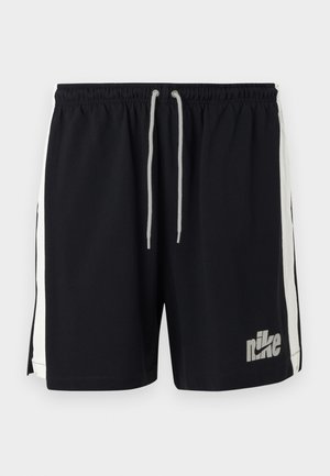 Shorts de sport Nike noirs avec des bandes blanches sur les côtés et une ceinture à cordon blanc, arborant un logo Nike gris sur la jambe avant gauche.