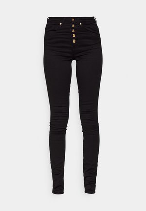 Black skinny jeans made of stretchy denim, featuring a high waist, five-button front closure, and two pockets. Smooth texture and slim fit.