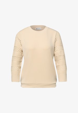 Pull beige à col rond avec manches longues en maille ouverte texturée et poignets et ourlet côtelés.