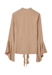 Blusa beige con maniche svasate, realizzata in un tessuto morbido. Caratterizzata da un dettaglio legato sul retro e una superficie liscia con cuciture minime.