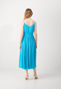 A sleeveless, midi-length dress in vibrant blue, featuring a cinched waist and flowing fabric with a smooth texture.