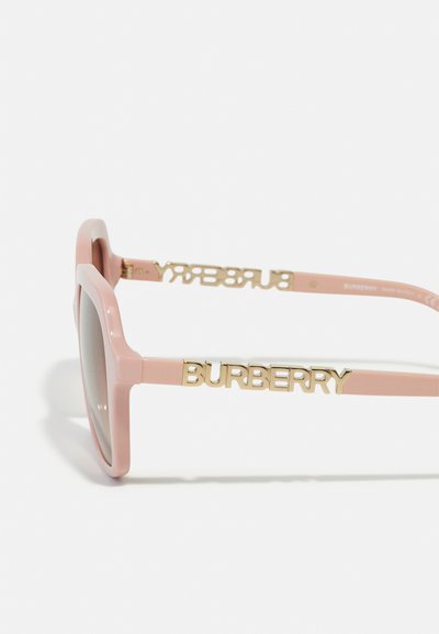 Burberry sunglasses with pink plastic frame, flat geometric shape, and gold logo accents on the temples. Lenses appear tinted.