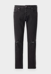 Jeans de mezclilla negra con ajuste slim, que presentan dos aberturas desgastadas en las rodillas y un diseño estándar de cinco bolsillos. Textura suave, hardware mínimo.