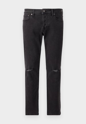 Black denim jeans with a slim fit, featuring two distressed knee openings and standard five-pocket design. Soft texture, minimal hardware.