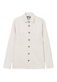 Licht beige langarm shirt van katoen, met een knoopsluiting aan de voorkant, twee borstzakken en donkere knopen voor contrast.