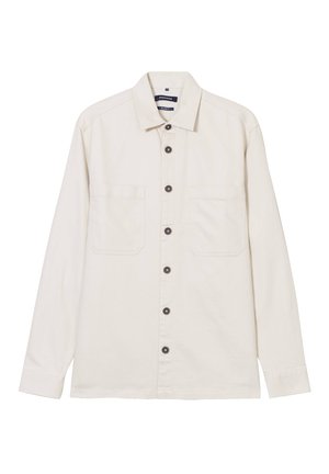 Helle beige Langarmbluse aus Baumwolle mit durchgehender Knopfleiste, zwei Brusttaschen und dunklen Knöpfen für den Kontrast.