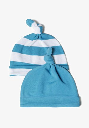 Two baby hats: one solid light blue, and one with white and blue stripes. Both feature a knotted top and soft cotton fabric.
