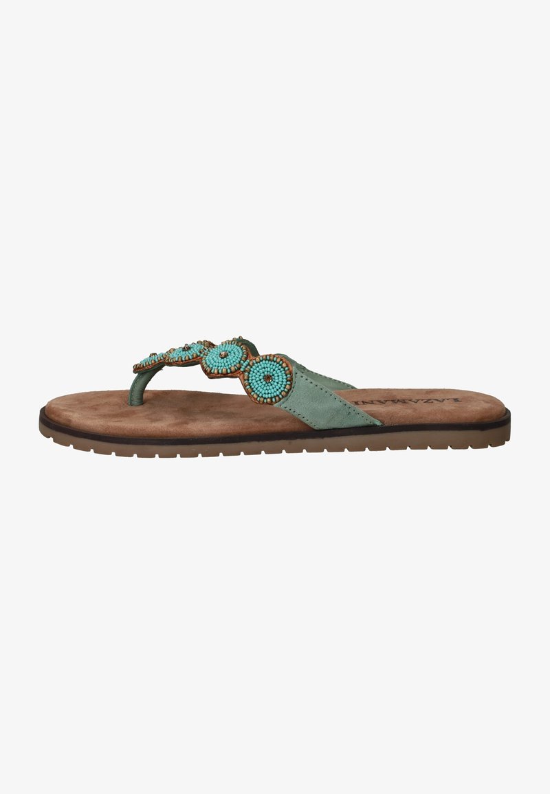 Groene flip-flop sandaal met beaded cirkelaccenten, zachte bruine voetbed en geprofileerde zool, met een verstelbaar strapdesign.