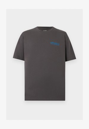 T-shirt en coton gris foncé à manches courtes avec petit logo bleu "Atlassian Williams Racing" sur le haut gauche de la poitrine.
