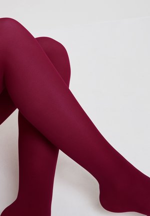 Collants opaques bordeaux avec une texture côtelée, présentés dans une position croisée sur un fond neutre. Fini lisse et couleur uniforme.