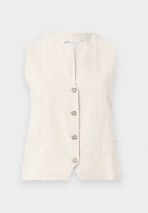 Αμάνικο μπεζ γιλέκο από λινό με τέσσερα κουμπιά στο μπροστινό μέρος και δύο πλαϊνές τσέπες στη μέση.