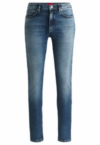 Jeans in denim blu con una vestibilità slim, dotati di cinque tasche, chiusura frontale con bottone e un effetto sbiadito per un aspetto usurato.