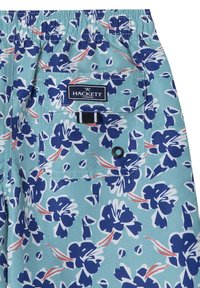 Pantaloni da bagno blu floreali con uno sfondo azzurro, vita elastica e una tasca sul retro con una patch del logo e chiusura a bottone.