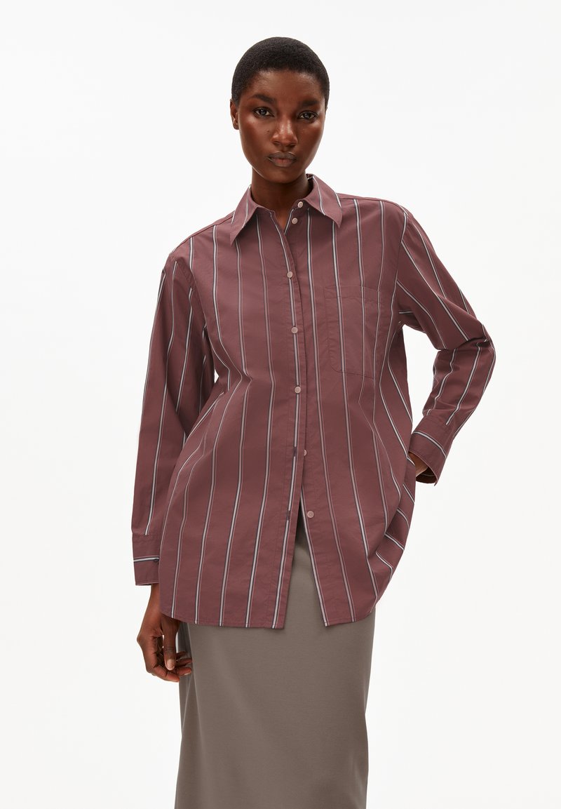 Maroon striped shirt with white vertical lines, long sleeves, button-down front, and a chest pocket. Cotton fabric, relaxed fit.
