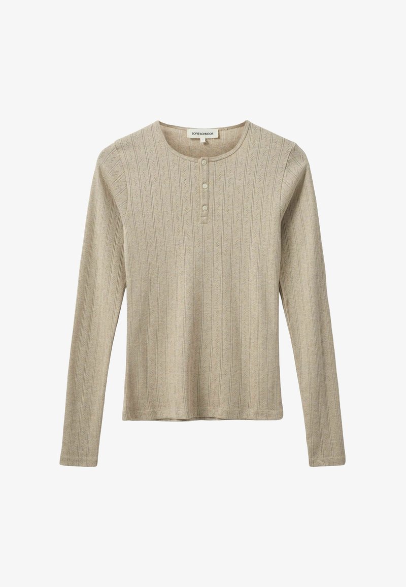 Világos bézs színű, hosszú ujjú felső, függőleges textúrált csíkokkal, kerek nyakkal és öt gombos üstökön elöl. Puha, kötött anyag.