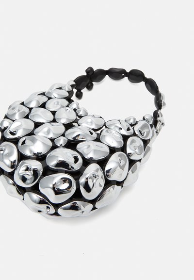 Silver metallic handbag with a rounded shape and textured surface, featuring glossy pebble-like accents and a black beaded handle.