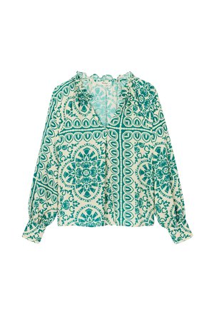Blouse à manches longues avec des motifs floraux et géométriques complexes verts et blancs, dotée d'un col en V à volants et de poignets froncés.