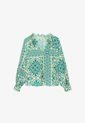 Blouse à manches longues avec des motifs floraux et géométriques complexes verts et blancs, dotée d'un col en V à volants et de poignets froncés.
