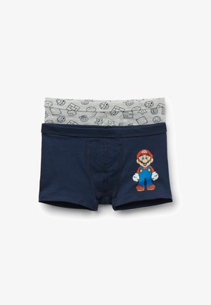 Boxers pour enfants bleu marine avec ceinture grise ornée d'icônes de Super Mario et un personnage Mario coloré sur la jambe.