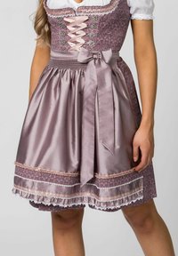 Traditional dirndl in mauve with a satin skirt, lace accents, and a fitted bodice featuring pink ribbon lacing and floral patterns.