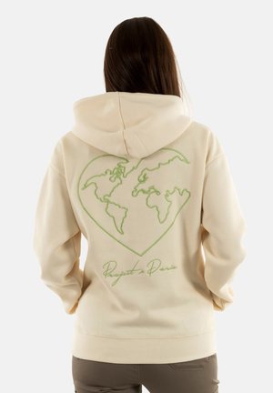 Haut à capuche crème avec un contour vert en forme de cœur et une carte du monde au dos. Tissu doux, coupe décontractée, poignets et ourlet côtelés.