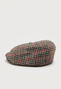 Gorro de l�ã com padrão pied-de-poule em tons de castanho, verde e vermelho. Forma arredondada com uma pequena etiqueta de logo de lado. Tecido texturizado.