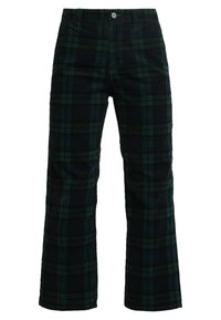 Pantalons en velours côtelé à carreaux vert foncé et bleu marine, avec fermeture à bouton et à glissière, coupe droite et poches latérales.