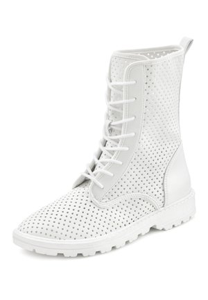 White ankle boots made of perforated material with a textured finish, featuring lace-up closure and a durable rubber sole.