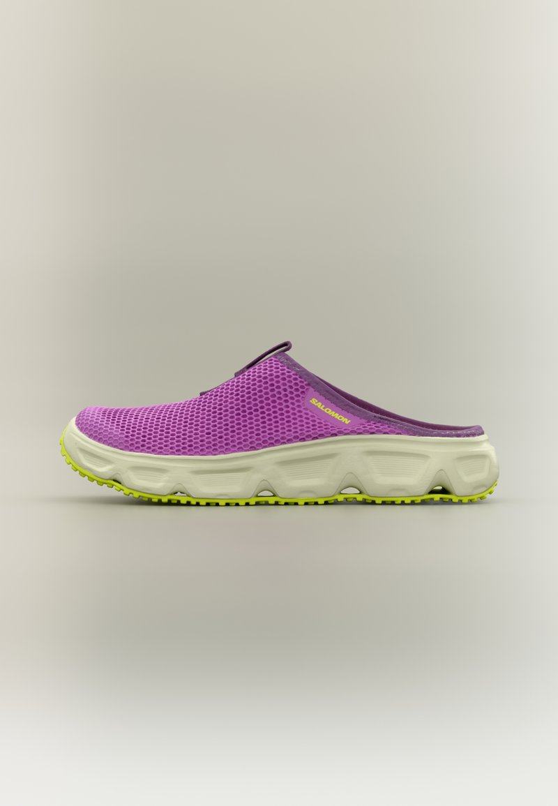 Μωβ πλεκτό παπούτσι slip-on  με υφασμένο επάνω μέρος, ελαφρύ λευκό μεσαίο πέλμα και φωτεινή πράσινη εξωτερική σόλα για πρόσφυση. Διακριτά διάφορα σχεδιαστικά στοιχεία.