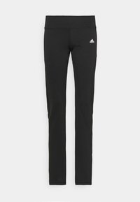 Schwarze Sportleggings aus elastischem Stoff mit einem hohen Taillenbund und einem kleinen weißen adidas-Logo auf der linken Seite.