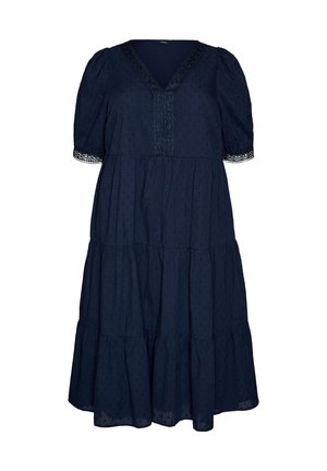 Navy blue midi dress with puff sleeves, V-neckline, textured polka dots, lace trim on sleeves and front, and tiered skirt.