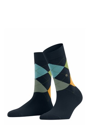 Ciemnoniebieskie skarpetki z wzorem argyle w odcieniach teal, zieleni i pomarańczy, wyeksponowane pionowo na białym tle.