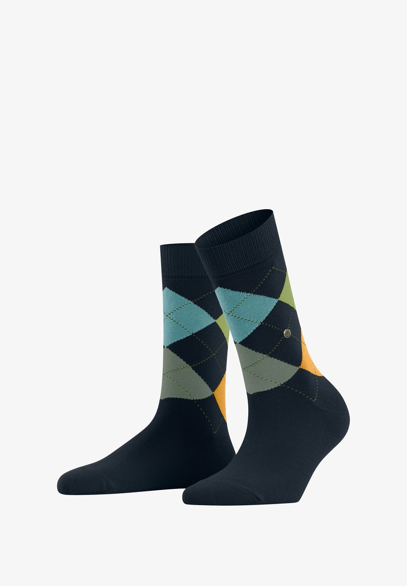 Ciemnoniebieskie skarpetki z wzorem argyle w odcieniach teal, zieleni i pomarańczy, wyeksponowane pionowo na białym tle.