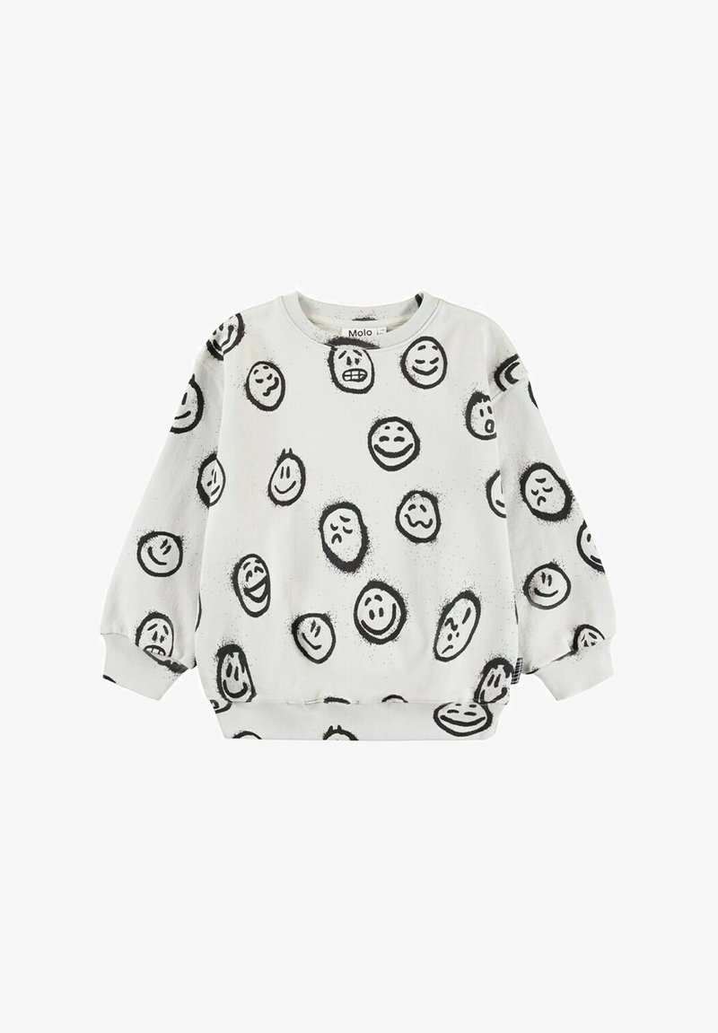 Witte trui met een patroon van zwarte blije en verdrietige gezichten. Het heeft lange mouwen, een ronde halslijn en ribgebreide boorden en zoom.