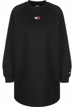 Sort sweatshirt-kjole med lange ærmer og rund hals, Tommy Jeans logo patch på brystet og lille logo på venstre manchet.