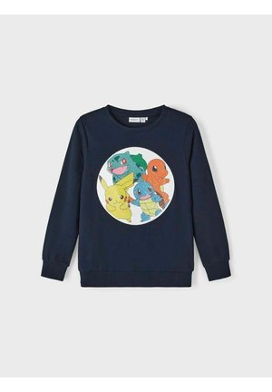 Laivaston värinen collegepaita, jossa on pyöreä graafinen printti, jossa on neljä värikästä sarjakuvahahmoa: Pikachu, Bulbasaur, Charmander ja Squirtle.