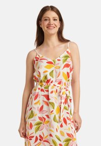 Blumendruckkleid mit verstellbaren Spaghetti-Trägern, das lebendige rote, gelbe und grüne Blattmuster auf einem cremefarbenen Hintergrund sowie einen Bindegürtel aufweist.