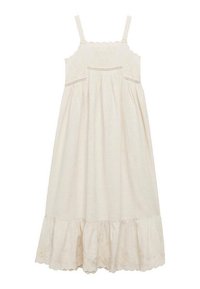 Abito beige chiaro con spalline sottili, corpetto ricamato a scallop, vita arricciata e orlo a strati con volant e motivi floreali.