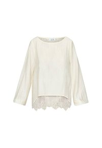 Lys beige langærmet bluse med rund halsudskæring, der har et tekstureret stof og en bølget blondekant nederst.