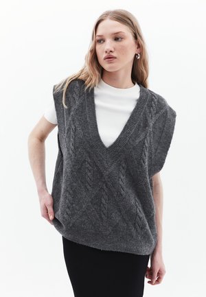 Gray knitted vest with a V-neck, featuring a cable knit pattern and short sleeves, worn over a white shirt, set against a light background.