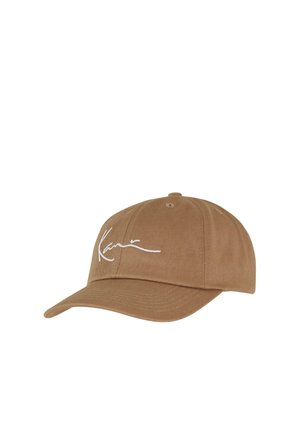 Brown cotton baseball cap featuring a curved brim and white embroidered signature on the front. Six-panel construction with ventilation holes.