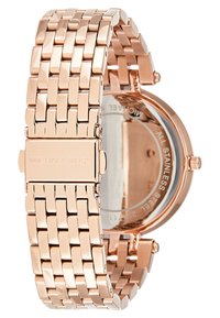Zegarek Michael Kors z różowo-złotą stalową bransoletą, okrągłą kopertą oraz szklanym tyłem, który odsłania wewnętrzny cyferblat.