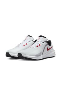 Pantofi sport albi cu accente roșii, superior texturat, căptușeală neagră și talpă texturată neagră, concepută pentru tracțiune și stabilitate.