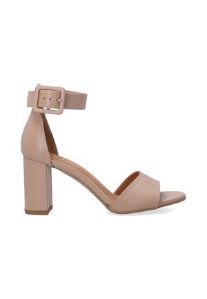 Beige high-heeled sandal with a thick block heel, open toe, and ankle strap featuring a square buckle closure. Smooth leather texture.