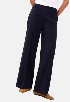 Marineblaue Hosen mit weitem Bein aus weichem Stoff mit glatter Textur. Mit flachem Bund und dezenten vorderen Nähten.