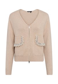Beige Strickjacke mit V-Ausschnitt und Reißverschluss. Verfügt über zwei Taschen, die mit Perlenakzenten verziert sind. Gerippte Bündchen und Saum.