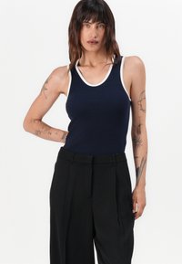 Tommy Hilfiger RELAXED STRAIGHT - Trousers - black