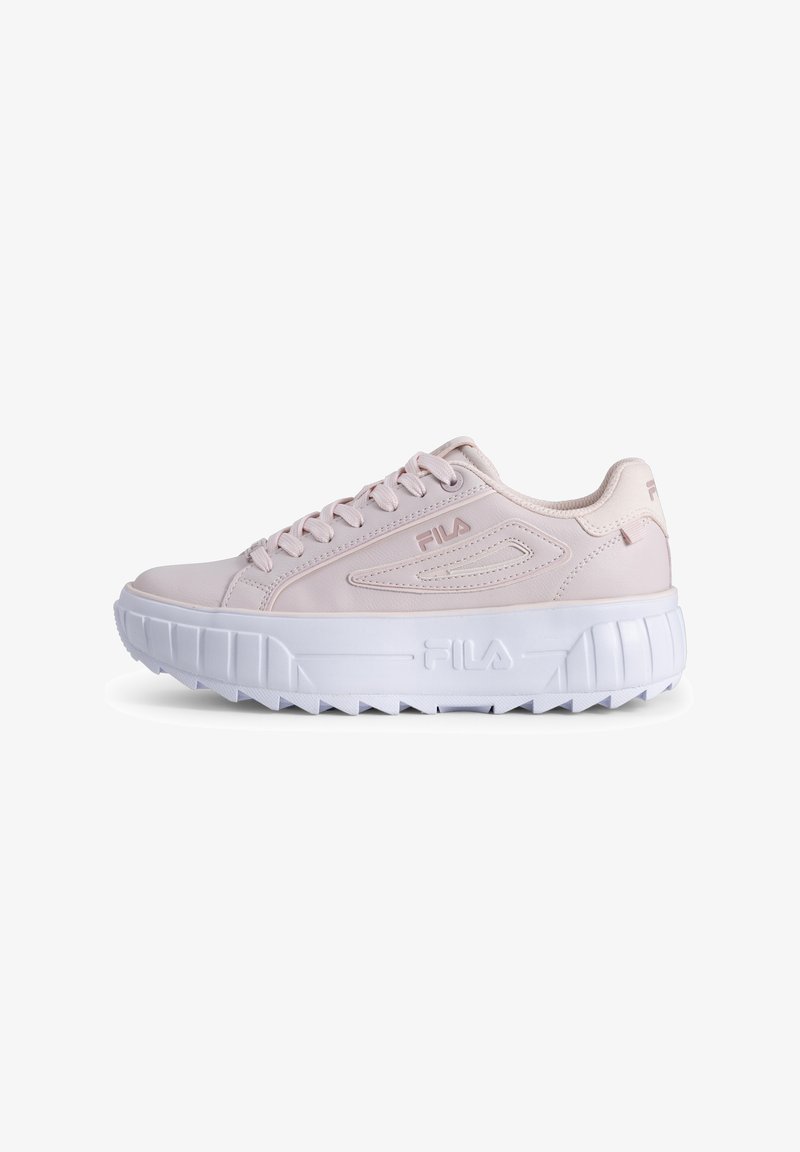 Light pink sneaker with a smooth synthetic material, round toe, thick white sole, and textured traction design. Features logo on the side.